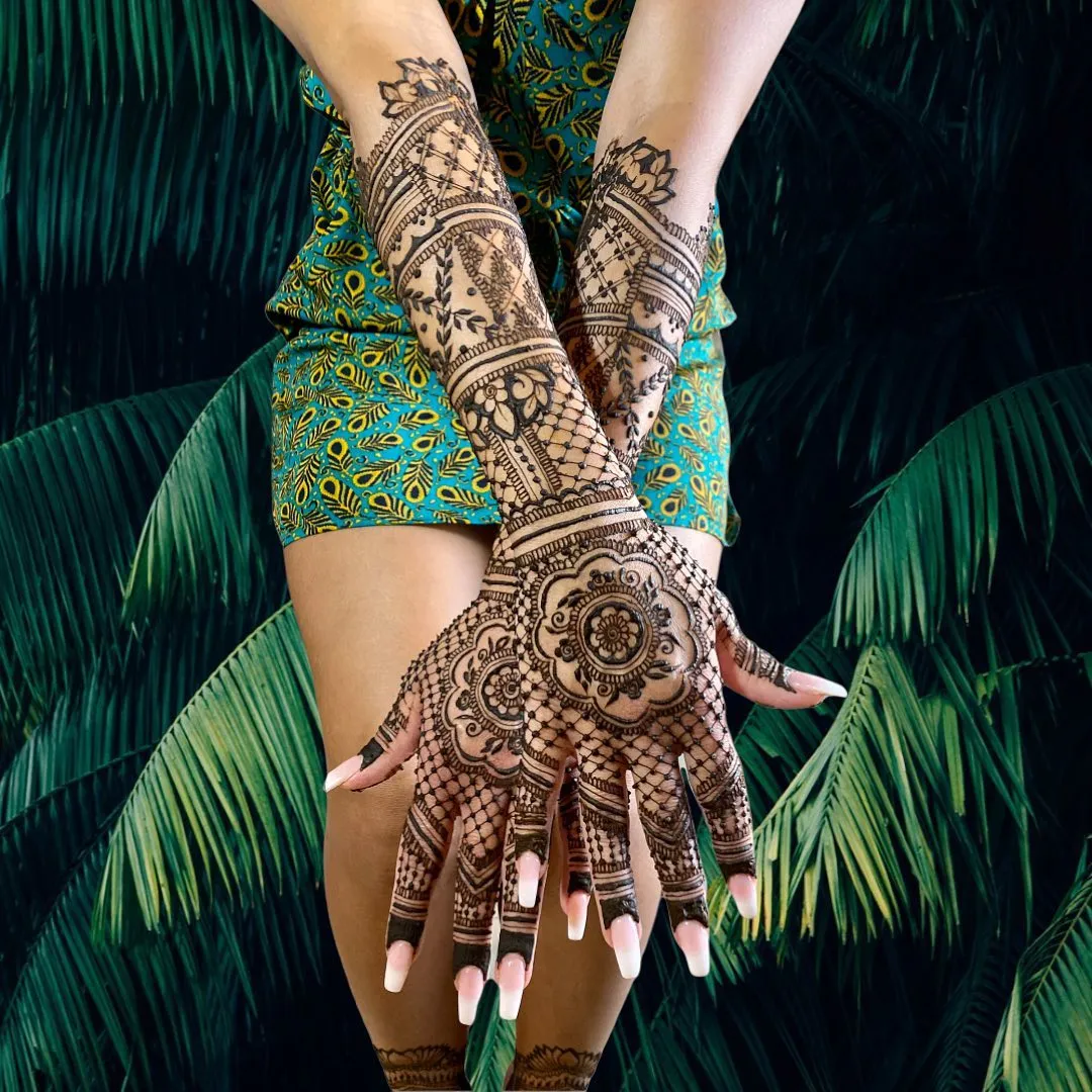 An elaborate full backhand mehndi design