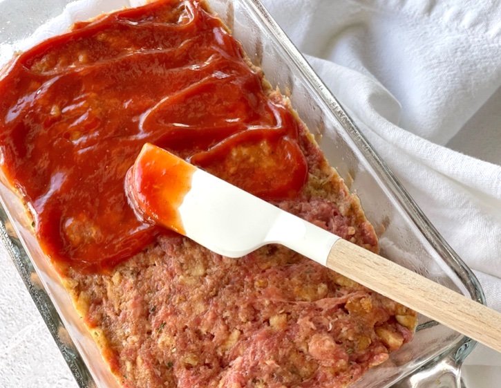 Quick and easy meatloaf recipe with stuffing and ketchup