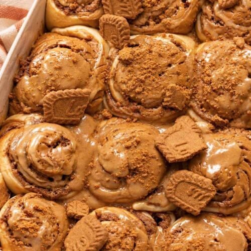 There’s something magical about pulling a pan of warm cinnamon rolls from the oven, especially when those rolls are packed with Biscoff cookie butter. These Biscoff Cookie Butter Cinnamon Rolls take the classic homemade cinnamon roll and give it a delicious cookie-butter twist. The dough is soft and fluffy, the center is filled with buttery brown sugar, cinnamon, and rich Biscoff spread, and the finished rolls can be topped with a creamy Biscoff frosting or an extra drizzle of warmed cookie butter. The result? Soft, gooey cinnamon rolls with warm cinnamon spice and that unmistakable caramelized Biscoff flavor in every bite. They’re perfect for a lazy weekend breakfast, holiday brunch, afternoon coffee, or whenever you're craving something sweet and comforting. Biscoff is especially well suited to cinnamon rolls because its caramelized, lightly spiced flavor complements the cinnamon filling beautifully. Why You'll Love Biscoff Cookie Butter Cinnamon Rolls Soft and fluffy texture: The homemade yeast dough bakes into wonderfully tender rolls with a pillowy center. Every bite has that bakery-style softness you want from a great cinnamon roll. Rich Biscoff flavor: Cookie butter melts into the cinnamon filling, creating a deep caramelized and gently spiced flavor. It turns an ordinary cinnamon roll into something extra special. Gooey cinnamon filling: Brown sugar, butter, cinnamon, and Biscoff create a luscious filling that settles beautifully between the layers. The center is the best part! Perfect for breakfast or brunch: These rolls make a cozy weekend breakfast but are also impressive enough for holidays and special occasions. Serve them warm with coffee, tea, or a cold glass of milk. A Biscoff lover's dream: From the filling to the optional frosting and cookie crumbs, there are plenty of ways to add more Biscoff flavor. One bite and you'll understand the obsession. What Makes Homemade Better? Store-bought cinnamon rolls are convenient, but homemade rolls have a completely different texture and flavor. When you make these Biscoff cinnamon rolls from scratch, you can control the dough, filling, sweetness, and amount of cookie butter. The dough is allowed to rise until soft and puffy, giving the finished rolls a tender texture that pairs beautifully with the rich filling. Homemade also means you can serve them warm from the oven, when the Biscoff filling is soft and gooey and the aroma of cinnamon fills the kitchen. And perhaps the biggest advantage is customization. Want extra cookie butter? Add it. Love crushed Biscoff cookies? Sprinkle them over the top. Prefer cream cheese frosting? Make it extra thick. Ingredients You’ll Need These irresistible Biscoff Cookie Butter Cinnamon Rolls feature a pillowy homemade dough wrapped around a decadent cinnamon-cookie butter filling, all finished with a silky glaze on top. The recipe involves a few steps, but every ingredient is straightforward to track down. This batch yields about 10 to 12 cinnamon rolls. For the Dough All-purpose flour — Creates the structure for the rolls while keeping the dough tender. Warm whole milk — Adds richness and moisture while helping create a soft, fluffy dough. Active dry or instant yeast — Gives the dough its lift and creates those light, airy layers. Granulated sugar — Adds sweetness to the dough and helps create a beautifully tender texture. Unsalted butter — Brings richness and softness to the dough. Eggs — Add structure, richness, and tenderness. Salt — Balances the sweetness and brings out the flavors of the butter, cinnamon, and Biscoff. For the Biscoff Filling Biscoff cookie butter — The star ingredient, adding that signature caramelized cookie flavor throughout the swirls. Unsalted butter — Helps create a rich, spreadable filling that melts beautifully into the dough. Brown sugar — Adds deep molasses sweetness and helps create a gooey cinnamon-roll center. Ground cinnamon — Gives the filling its classic warm, aromatic cinnamon flavor. Crushed Biscoff cookies — Optional, but highly recommended if you want extra cookie flavor and a little texture. For the Topping Cream cheese — Creates a smooth, slightly tangy frosting that balances the sweetness of the cookie butter. Biscoff cookie butter — Adds another layer of caramelized cookie flavor to the frosting. Powdered sugar — Sweetens the frosting while keeping it smooth. Vanilla extract — Adds a subtle layer of warmth and rounds out the flavors. Milk or heavy cream — Helps adjust the frosting to the perfect drizzleable consistency. Extra Biscoff cookies — Crushed cookies make an easy and attractive finishing touch. The combination of cookie butter, cinnamon, brown sugar, and a creamy topping is a common approach in Biscoff cinnamon-roll recipes because the flavors complement the enriched dough particularly well. Step-By-Step Direction Step 1: Prepare the Yeast Warm the milk until it is comfortably warm rather than hot. Combine it with the yeast and a little sugar, then let it sit until the mixture becomes foamy. If you're using instant yeast, you can generally mix it directly into the dough ingredients, but allowing the yeast to foam is a useful way to check that active dry yeast is working. Step 2: Make the Dough Add the melted butter, eggs, sugar, flour, and salt. Mix until a soft dough forms. Knead the dough until it becomes smooth and elastic. It should feel soft and slightly tacky rather than dry and stiff. Avoid adding too much flour because that can make the finished cinnamon rolls heavy. Step 3: Let the Dough Rise Place the dough in a lightly greased bowl and cover it. Let it rise in a warm, draft-free place until it becomes noticeably puffy and roughly doubles in size. This first rise is important because it gives the yeast time to develop the dough's structure and airy texture. Similar Biscoff cinnamon-roll recipes use a first rise followed by a second proof after shaping. Step 4: Roll Out the Dough Transfer the risen dough to a lightly floured surface and gently roll it into a large rectangle. Try to keep the thickness fairly even so the finished rolls bake consistently. Step 5: Add the Biscoff Filling Spread softened butter over the dough, followed by a thin, even layer of Biscoff cookie butter. Sprinkle the brown sugar and cinnamon evenly over the top. For even more Biscoff flavor, add finely crushed Biscoff cookies. Don't make the filling excessively thick. A thin, even layer makes the dough easier to roll and helps keep the beautiful spiral intact. Step 6: Roll and Slice Starting from one long edge, carefully roll the dough into a snug log. Use a sharp knife or unflavored dental floss to cut the log into even pieces. Arrange the rolls in a greased baking dish with the swirls facing upward. Step 7: Give the Rolls a Second Rise Cover the shaped rolls and allow them to rise again until they look soft, puffy, and expanded. This second proof helps produce the light, fluffy texture associated with bakery-style cinnamon rolls. Step 8: Bake Until Golden Bake the rolls in a preheated oven until the tops are lightly golden and the center rolls are cooked through. Keep an eye on them toward the end of baking. You want the rolls baked through but still soft and tender rather than dry. Step 9: Make the Biscoff Frosting While the rolls cool slightly, beat softened cream cheese and butter until smooth. Add Biscoff cookie butter, powdered sugar, and vanilla, then mix until creamy. If the frosting is too thick, add a small amount of milk or cream until it reaches your preferred consistency. Step 10: Frost and Serve Spread the frosting generously over the warm cinnamon rolls. For the ultimate Biscoff finish, drizzle warmed cookie butter over the top and scatter crushed Biscoff cookies across the rolls. Serve while they're still warm and gooey. Serving Suggestions With morning coffee — The caramelized cookie flavor pairs beautifully with a hot cup of coffee. With a cold glass of milk — A classic combination that balances the richness of the rolls. For weekend brunch — Serve alongside fresh berries, scrambled eggs, or a savory breakfast casserole. For holiday breakfast — These make a cozy addition to Thanksgiving, Christmas, or other special-morning menus. As an afternoon dessert — Warm one slightly and enjoy it with tea or coffee. With extra Biscoff drizzle — Warm a little cookie butter until smooth and drizzle it over individual servings. With crushed cookies — Add extra Biscoff crumbs immediately before serving for texture and visual appeal. Tips for the Best Results Don't over-flour the dough: A slightly tacky dough usually produces softer cinnamon rolls than a stiff, heavily floured dough. Add flour gradually and stop when the dough becomes manageable. Use warm, not hot, milk: Extremely hot milk can damage the yeast. The milk should feel warm rather than steaming hot when you add it. Warm the cookie butter slightly: Biscoff spread becomes easier to spread when gently warmed. A thin layer gives you better swirls and makes rolling the dough easier. Give the dough enough time to rise: Don't rely only on the clock; look for a dough that has become noticeably puffy and expanded. The dough's appearance matters more than an exact rising time. Don't overbake: Cinnamon rolls continue to firm up as they cool. Bake just until golden and cooked through so they stay soft and gooey in the center. Storage Tips Refrigerator Store leftover Biscoff cinnamon rolls in an airtight container in the refrigerator. They should stay soft for several days, although the texture is best when reheated. If possible, keep extra frosting separate and add it after reheating. Freezer For longer storage, freeze the baked rolls once they have cooled completely. Wrap individual rolls tightly and place them in a freezer-safe container or bag. You can also freeze the unbaked shaped rolls for a convenient make-ahead option, although the thawing and proofing process should be handled carefully. Reheating For the softest texture, warm individual rolls gently in the microwave until heated through. You can also reheat them in a low-temperature oven. Add a small drizzle of cookie butter or a little frosting afterward to bring back that fresh-from-the-oven richness. Make-ahead versions of Biscoff cinnamon rolls can also be assembled, refrigerated, and baked later; this is particularly useful for holiday breakfasts and brunches. Final Thoughts These Biscoff Cookie Butter Cinnamon Rolls are everything you want in a homemade sweet roll: soft, fluffy dough, a buttery cinnamon filling, rich cookie butter, and a creamy topping. The Biscoff flavor makes them feel a little more special than traditional cinnamon rolls without making the recipe complicated. They're the kind of treat that fills the kitchen with an irresistible aroma and makes everyone wonder when they can have the first one. For a cozy weekend breakfast, holiday brunch, or indulgent dessert, warm Biscoff cinnamon rolls are hard to resist. And if you're a serious Biscoff fan, don't stop with the frosting—add a warm cookie-butter drizzle and a sprinkle of crushed cookies right before serving. That's when these soft, gooey rolls really shine.